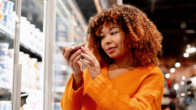 Woman checking a food label