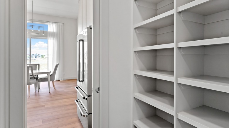 open pantry leads to a kitchen