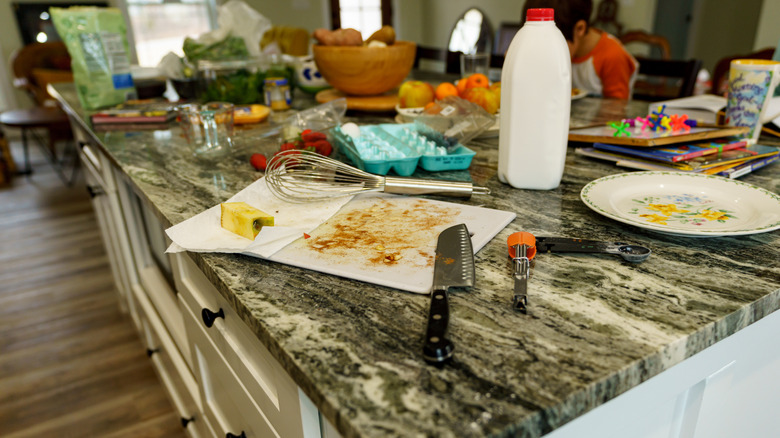 An untidy kitchen granite countertop