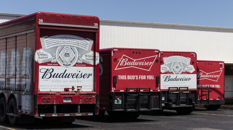 budweiser trucks line up at a warehouse loading dock