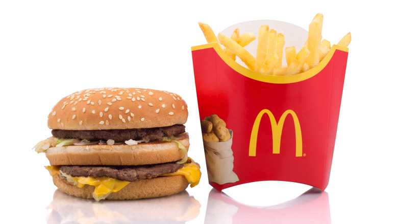 Big Mac hamburger and McDonalds fries on white background