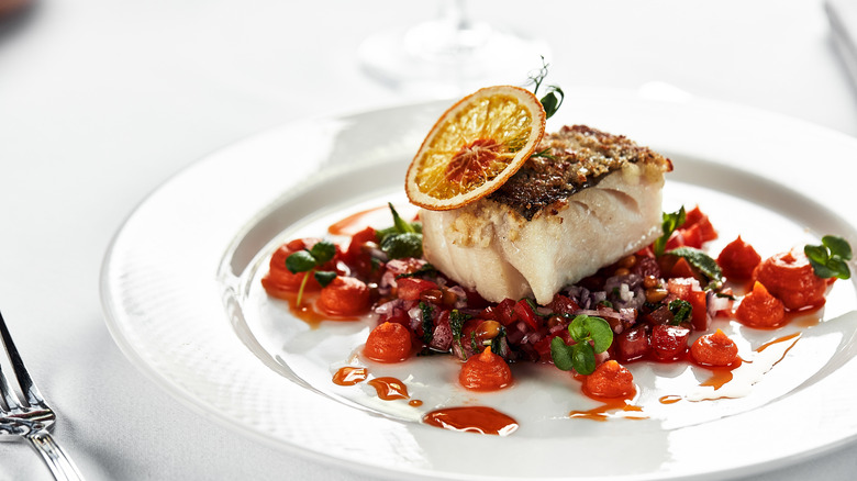 Baked fish with vegetables and orange