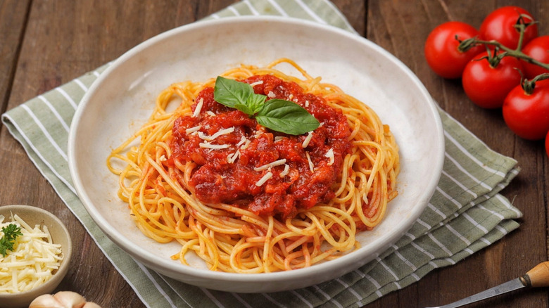 Spaghetti with chunky tomato sauce in bowl