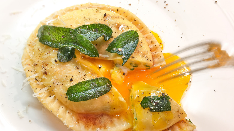 Egg yolk raviolo with crispy sage