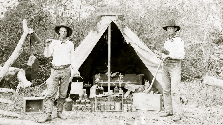 Two 1800s cowboys and their cooking apparel