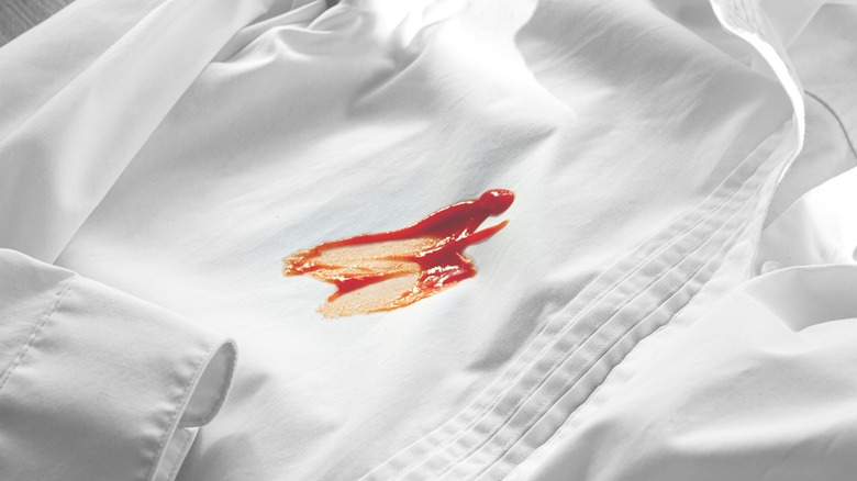 white dress shirt with red sauce stain