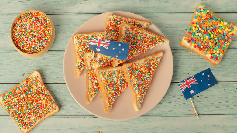 Fairy bread on plate and on table with two Australian flags