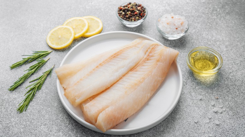 Raw pollock fillet with seasoning ingredients