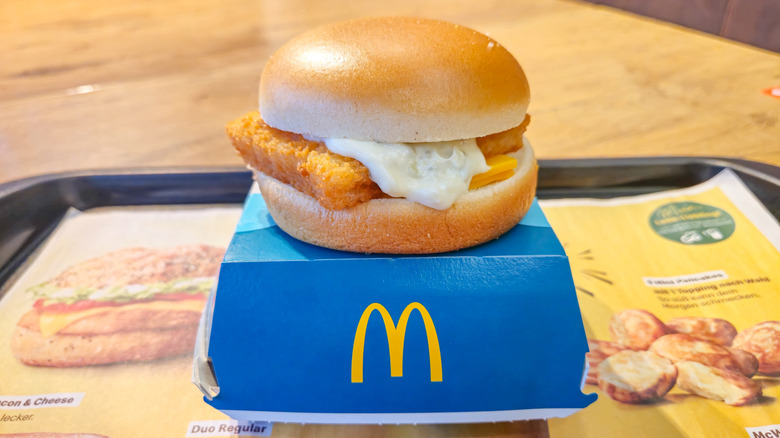 A Filet-O-Fish sits atop a clamshell box