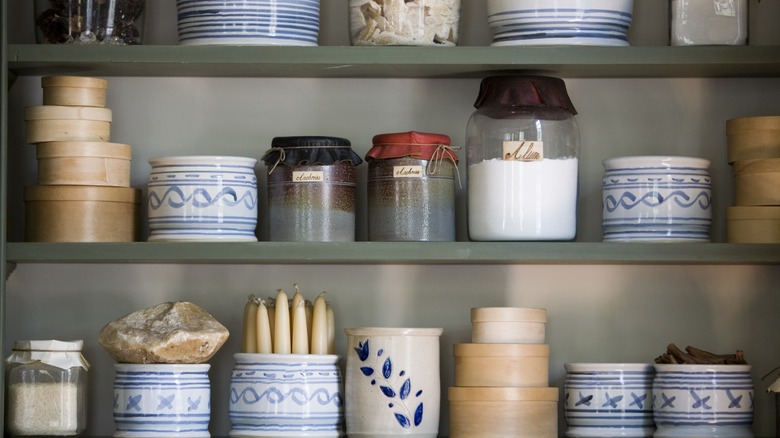 miscellaneous kitchen crocks on shelves