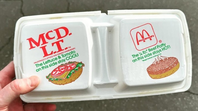 Hand holding vintage McDonald's McDLT packaging