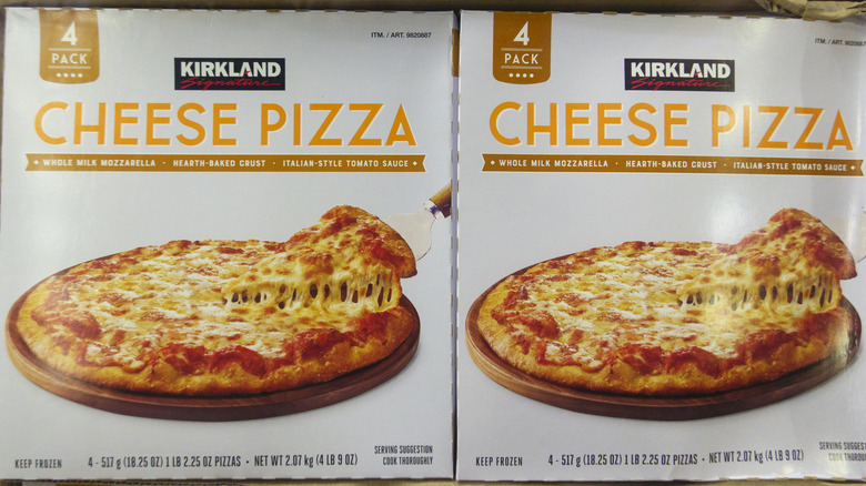 Two boxes of Kirkland Signature Cheese Pizza.