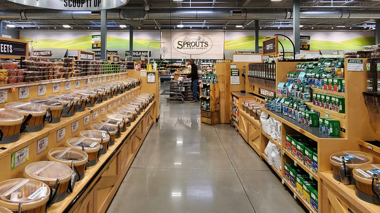 Interior of Sprouts Farmers Market store showing shelves and bulk bins.