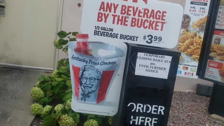 sign in kfc drive-thru advertising beverage bucket