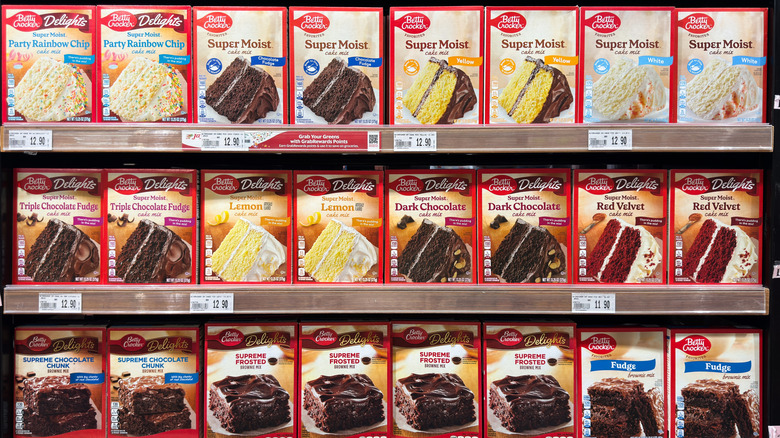 A selection of Betty Crocker cake mixes in the grocery aisle.