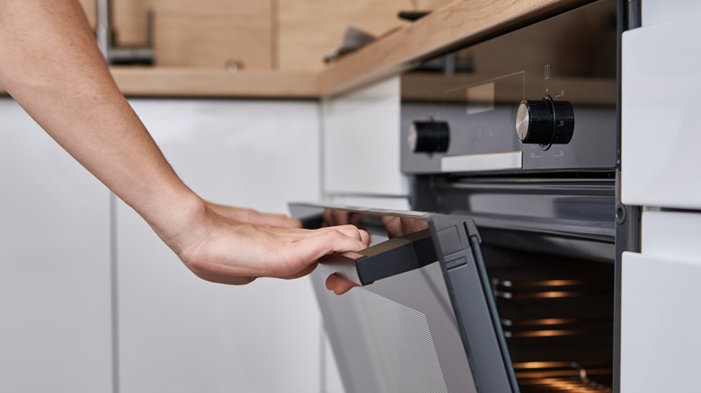 pressing button on oven