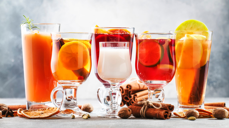 Various colorful cocktails including hot buttered rum
