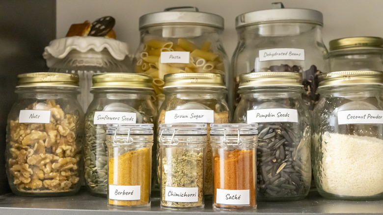 organized kitchen pantry with labels facing out.