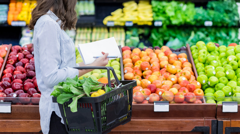 person shopping in produce section