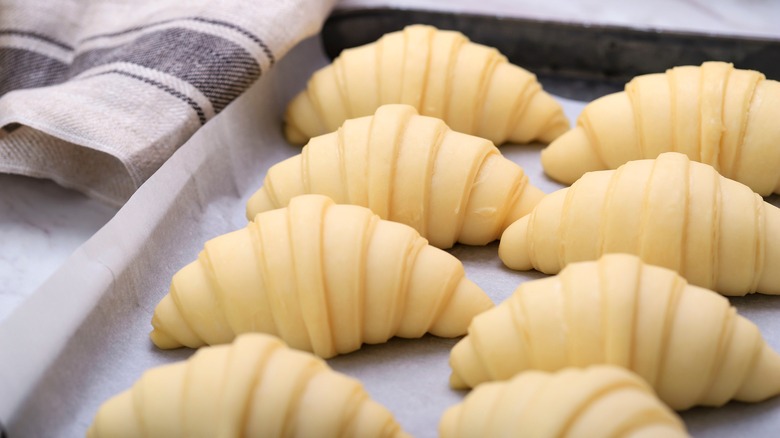 Croissants on a baking pan