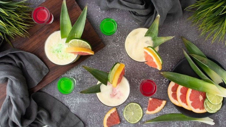 Top down view of Wicked cocktails with pink and green shooters