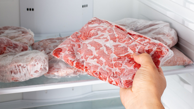 Frozen meat with hand