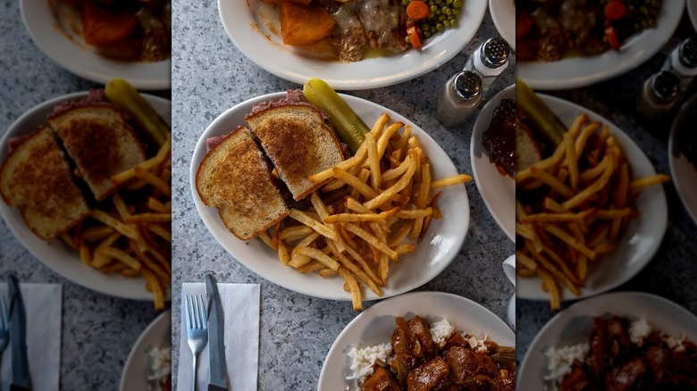 A top down view of plates of food from Valois Cafeteria in Chicago