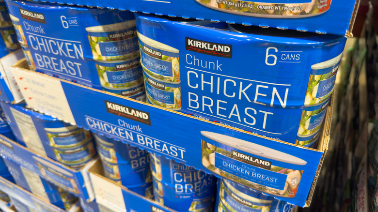 Cans of chicken breast in a store