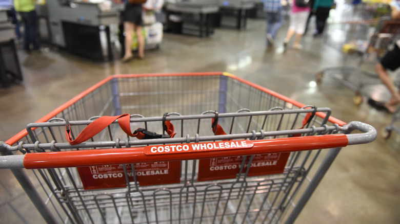 focus on costco shopping cart labeled with store name