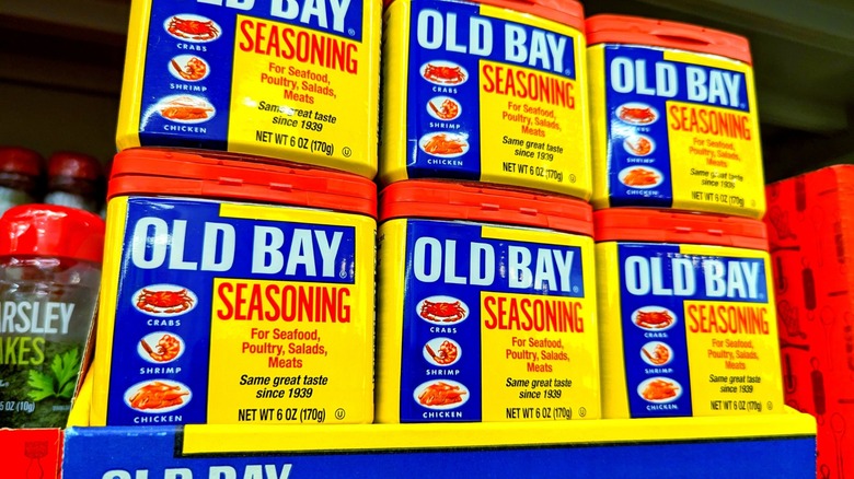 stack of old bay seasoning at grocery store
