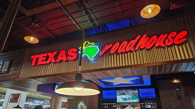 texas roadhouse sign over restaurant interior