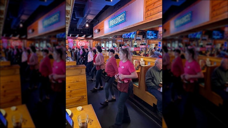 line-dancing texas roadhouse servers at restaurant in georgia