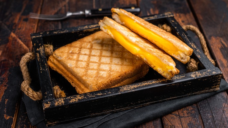 perfect grilled cheese on rustic tray