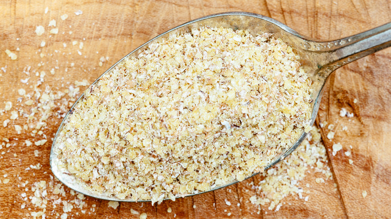 A heap of wheatgerm on a spoon
